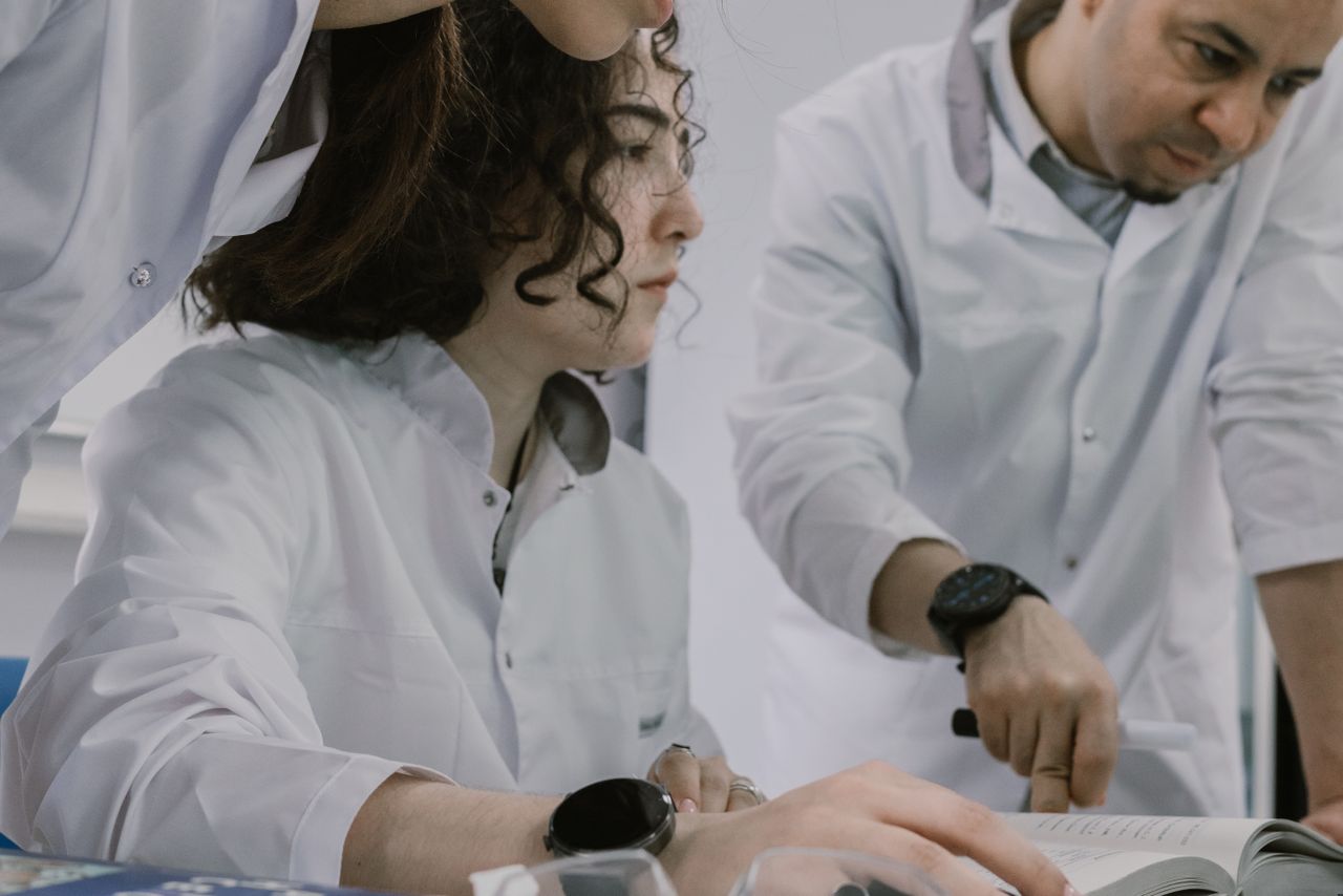services-01 Group of scientists working together in a lab, focused and collaborative atmosphere.